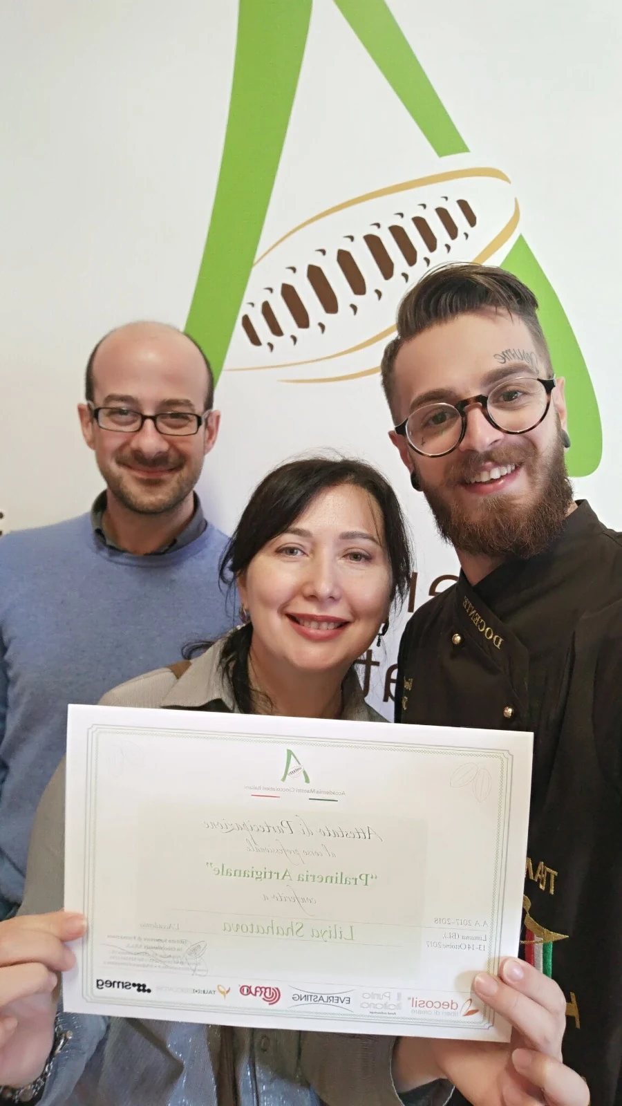 Liliya receiving her chocolatier academy certificate